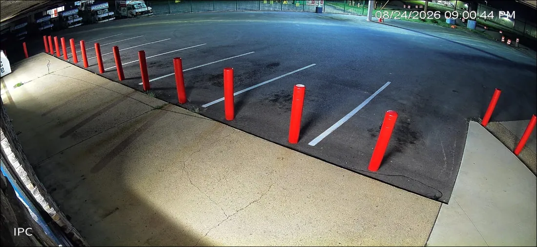 Night camera view of a rear parking lot