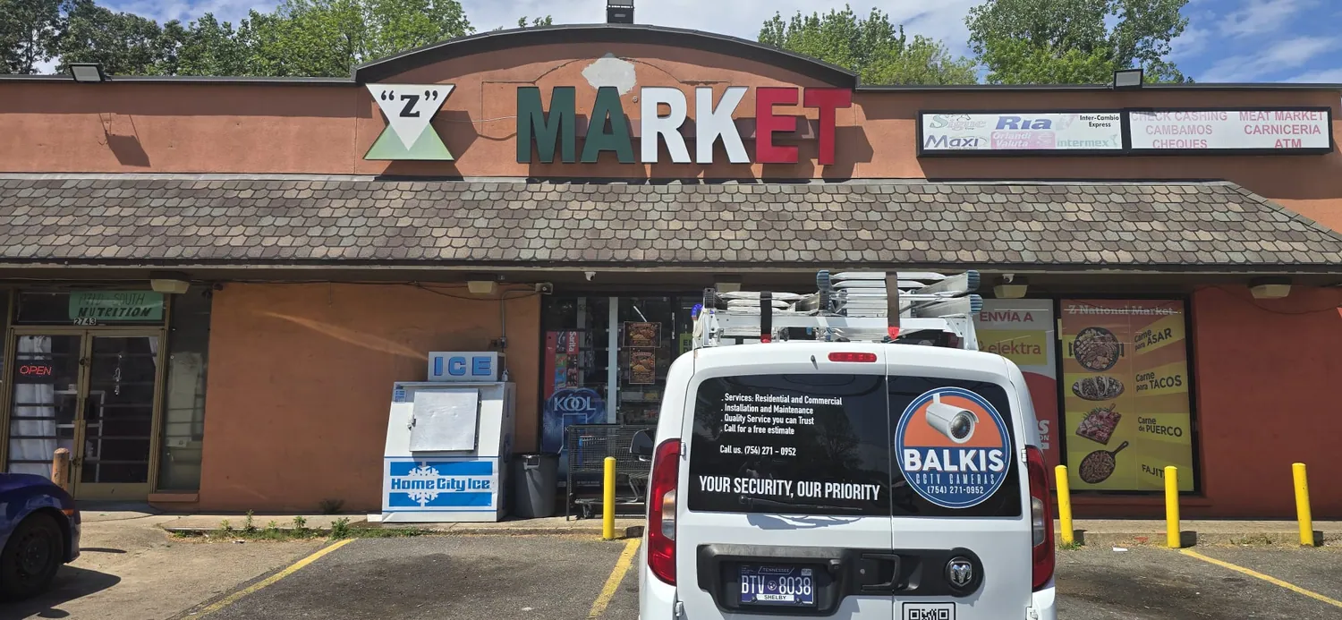 Balkis Cameras van outside a market during installation
