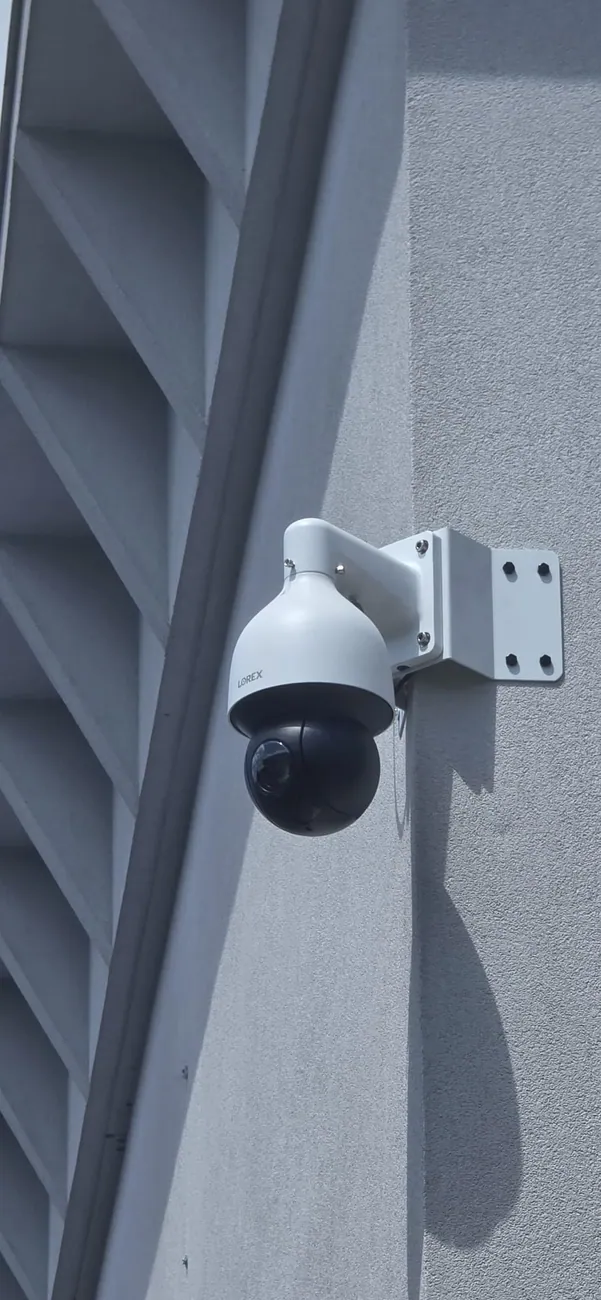 PTZ camera on a metal building wall