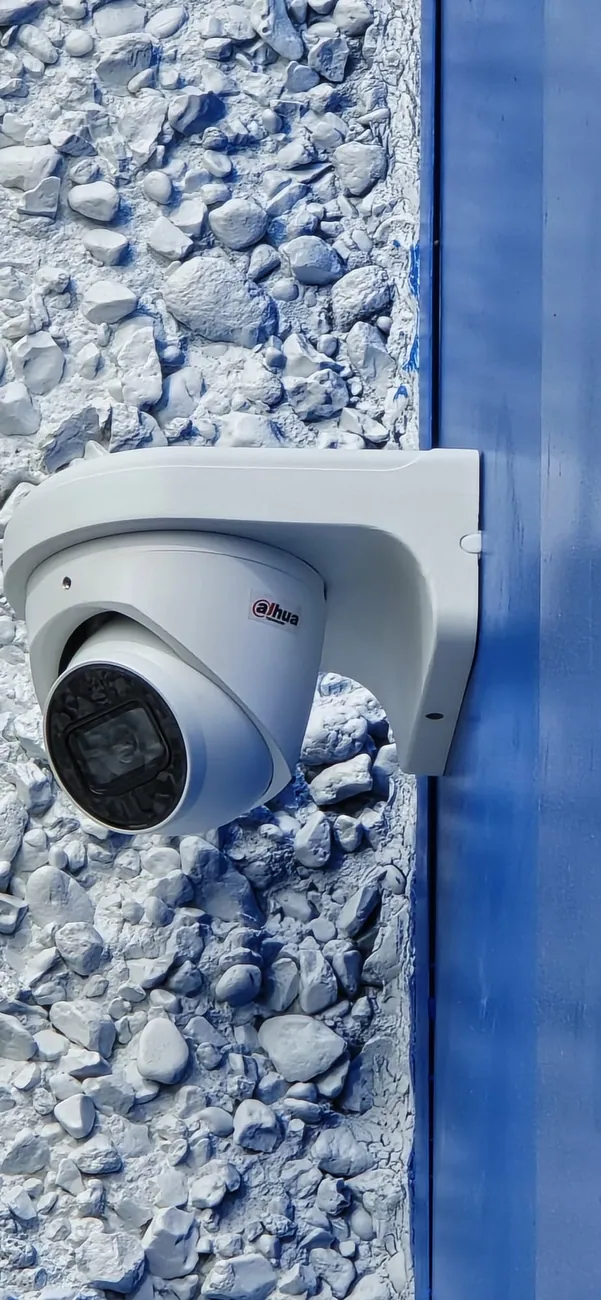 Turret camera installed on a stone-clad column